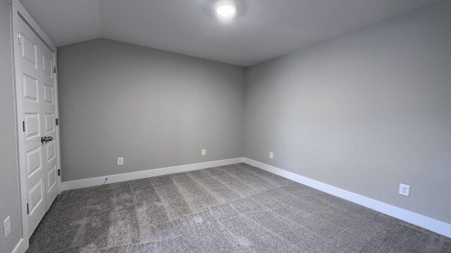 3522 Firerock Dr, Murfreesboro, TN 37128 - empty room featuring carpet floors, vaulted ceiling, and baseboards