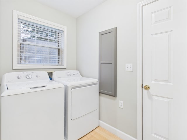 378 Roy Harris Rd, Kuttawa, KY 42055 - washroom with washing machine and dryer, baseboards, and light wood finished floors