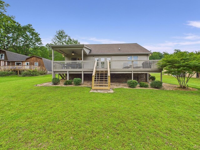 378 Roy Harris Rd, Kuttawa, KY 42055 - rear view of house featuring a ceiling fan, a wooden deck, a yard, and stairway