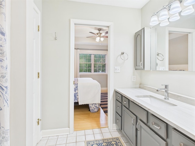 378 Roy Harris Rd, Kuttawa, KY 42055 - full bath featuring tile patterned flooring, ceiling fan, vanity, connected bathroom, and baseboards