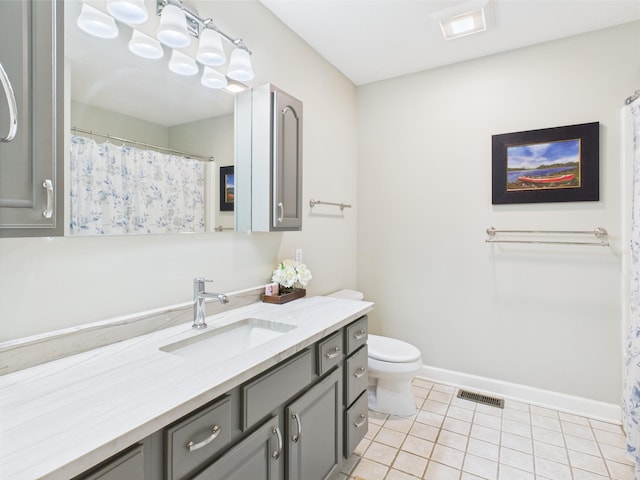 378 Roy Harris Rd, Kuttawa, KY 42055 - full bath with tile patterned floors, baseboards, vanity, and toilet