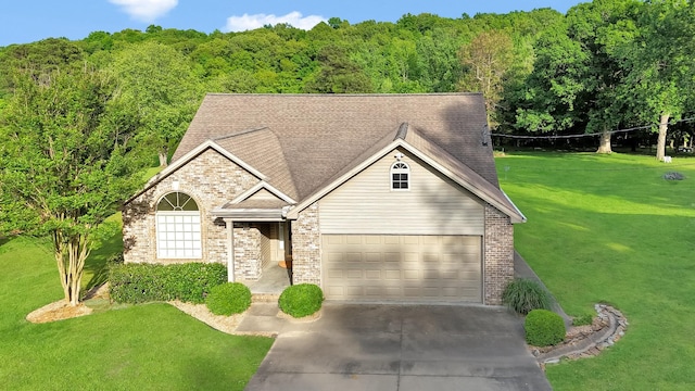 378 Roy Harris Rd, Kuttawa, KY 42055 - traditional-style house featuring concrete driveway, a front lawn, an attached garage, and brick siding