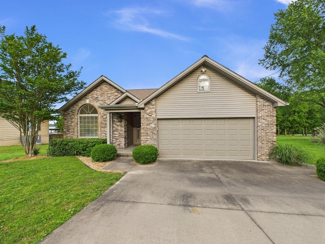378 Roy Harris Rd, Kuttawa, KY 42055 - single story home with concrete driveway, brick siding, an attached garage, and a front lawn