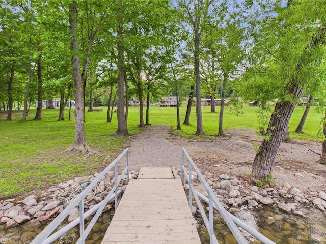 378 Roy Harris Rd, Kuttawa, KY 42055 - dock area with a lawn and view of wooded area