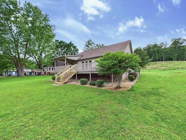 378 Roy Harris Rd, Kuttawa, KY 42055 - rear view of house featuring stairway, a yard, and a shingled roof