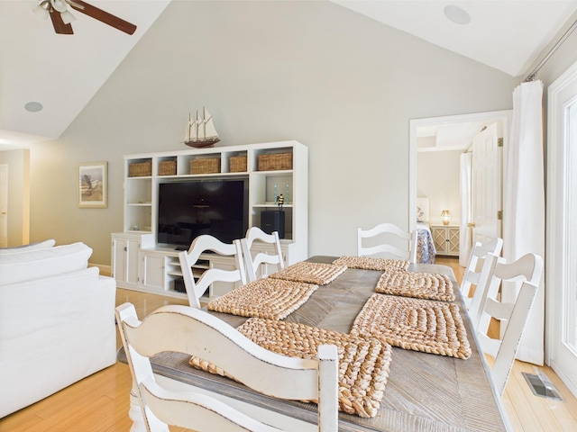 378 Roy Harris Rd, Kuttawa, KY 42055 - dining area featuring high vaulted ceiling, light wood-type flooring, and a ceiling fan