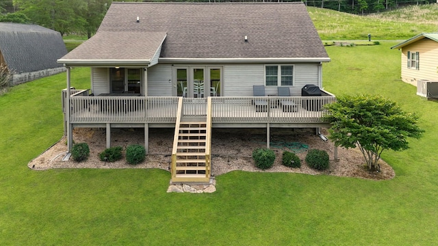 378 Roy Harris Rd, Kuttawa, KY 42055 - rear view of house featuring a shingled roof and a lawn