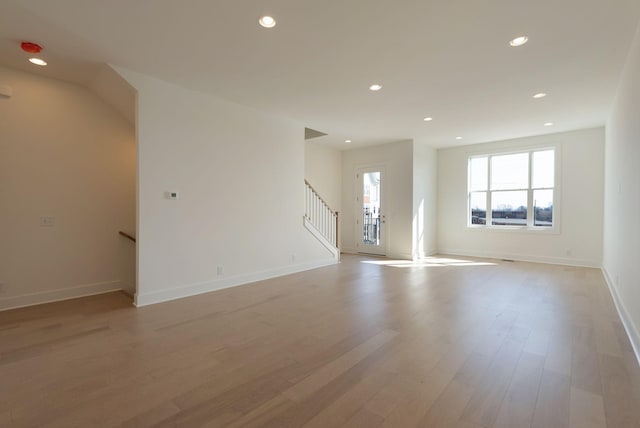 520 Proximity Cir, Nashville, TN 37207 - unfurnished living room with recessed lighting, light wood-style floors, baseboards, and stairway