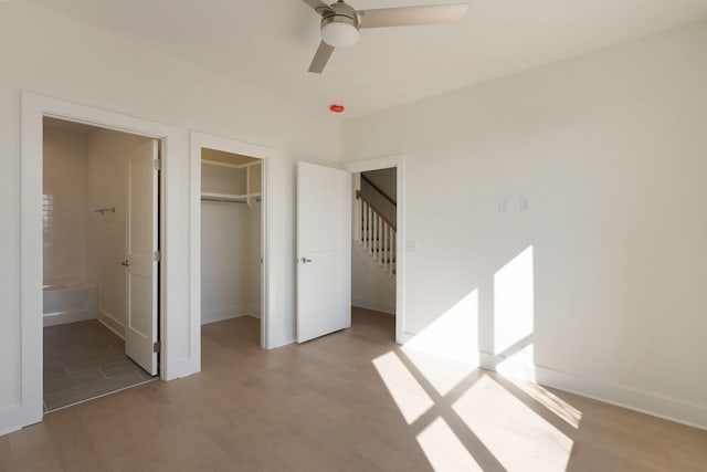 520 Proximity Cir, Nashville, TN 37207 - unfurnished bedroom featuring light wood-style flooring, baseboards, a walk in closet, and connected bathroom