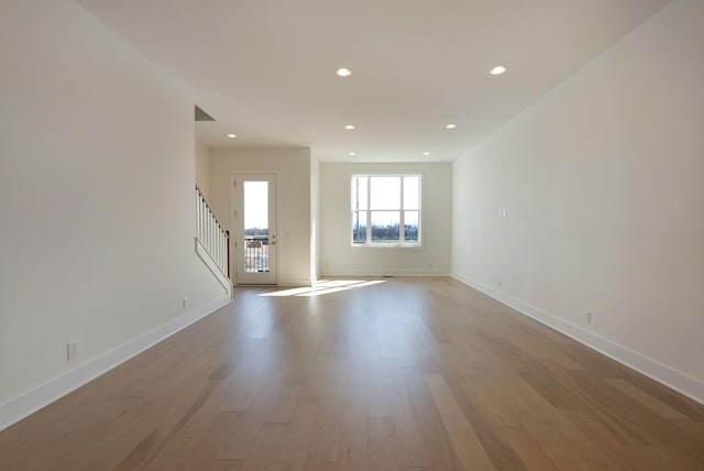 520 Proximity Cir, Nashville, TN 37207 - unfurnished room with stairs, wood finished floors, baseboards, and recessed lighting