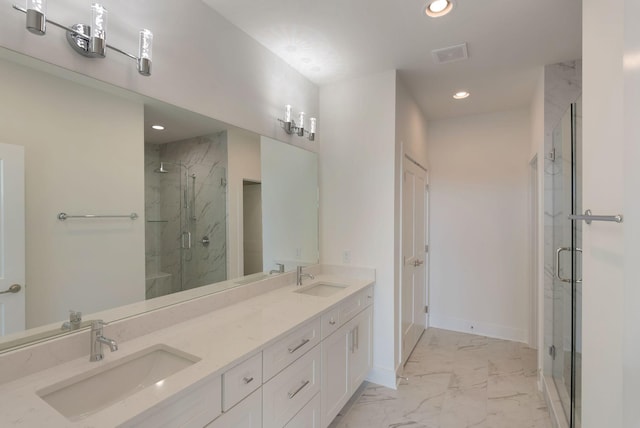 520 Proximity Cir, Nashville, TN 37207 - bathroom featuring marble look tile flooring, recessed lighting, a marble finish shower, baseboards, and double vanity