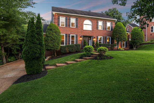 9455 Foothills Ct, Brentwood, TN 37027 - colonial house featuring a lawn and brick siding