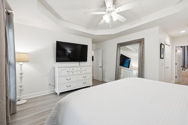 9455 Foothills Ct, Brentwood, TN 37027 - bedroom featuring light wood finished floors, a raised ceiling, ceiling fan, and recessed lighting
