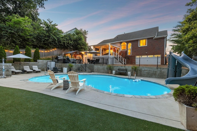 9455 Foothills Ct, Brentwood, TN 37027 - view of swimming pool featuring a water slide and a patio area