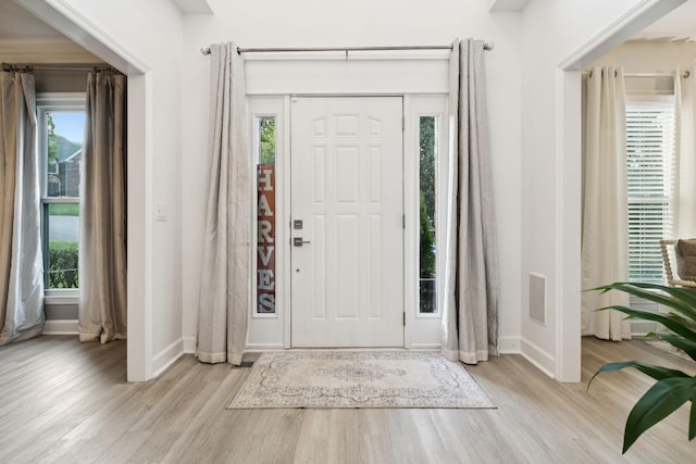 9455 Foothills Ct, Brentwood, TN 37027 - foyer entrance featuring wood finished floors and plenty of natural light