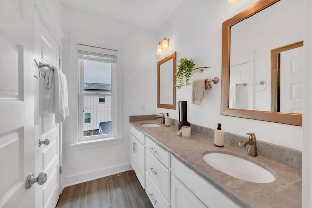 525B Stevenson St, Nashville, TN 37209 - bathroom with wood finished floors, double vanity, and baseboards