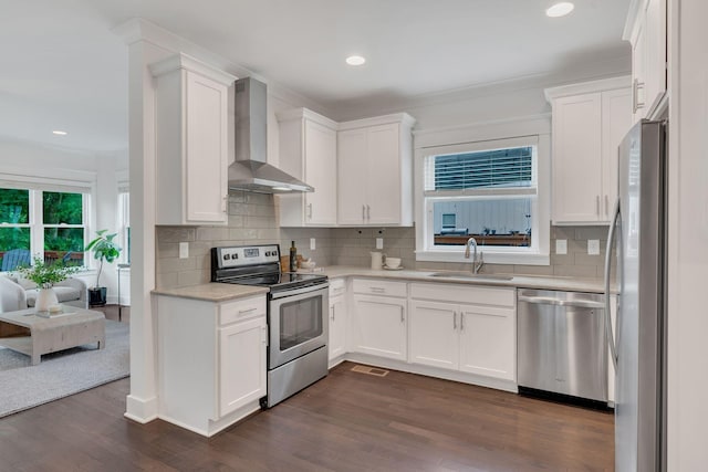 525B Stevenson St, Nashville, TN 37209 - kitchen with appliances with stainless steel finishes, wall chimney range hood, a sink, light countertops, and white cabinetry