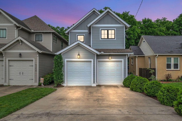 525B Stevenson St, Nashville, TN 37209 - view of front of home featuring board and batten siding, driveway, and an attached garage