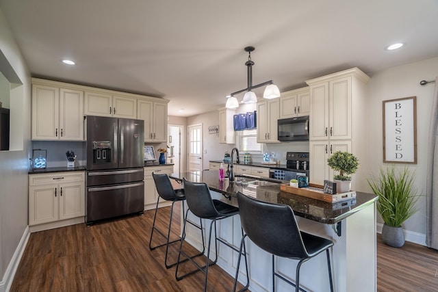 703 Brenda Ave, Loretto, TN 38469 - kitchen with black microwave, refrigerator with ice dispenser, stainless steel range with electric cooktop, a sink, and dark wood-type flooring