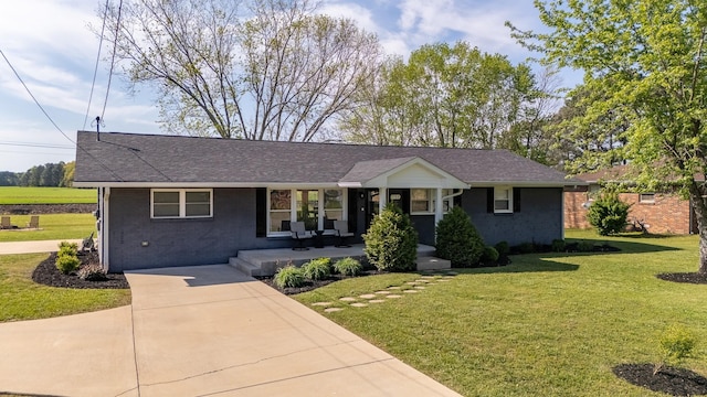 703 Brenda Ave, Loretto, TN 38469 - single story home featuring covered porch, a front lawn, brick siding, and driveway