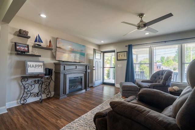 703 Brenda Ave, Loretto, TN 38469 - living room featuring dark wood-style flooring, baseboards, a glass covered fireplace, ceiling fan, and recessed lighting