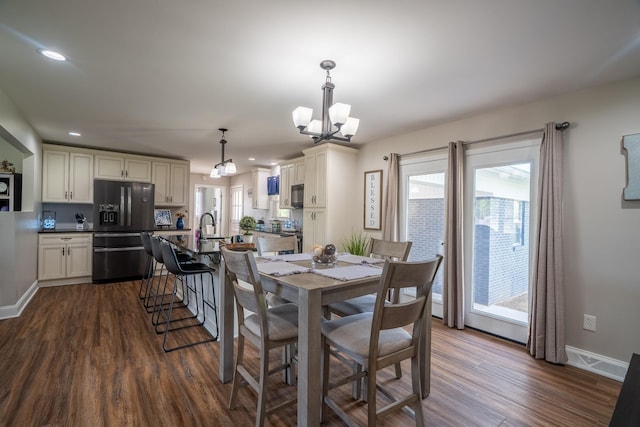 703 Brenda Ave, Loretto, TN 38469 - dining area with dark wood-style flooring, a chandelier, baseboards, and recessed lighting