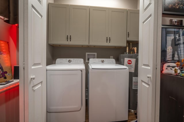 703 Brenda Ave, Loretto, TN 38469 - laundry room with electric water heater, cabinet space, and washing machine and clothes dryer