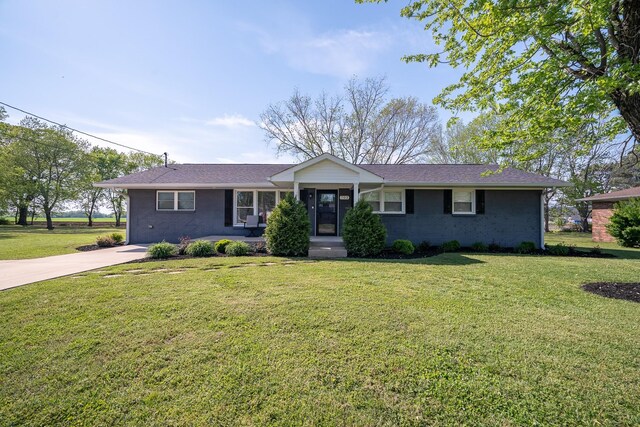 703 Brenda Ave, Loretto, TN 38469 - single story home featuring a front yard, brick siding, and concrete driveway