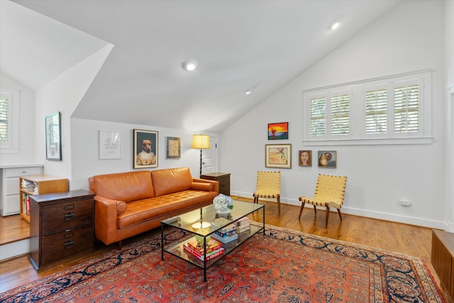 living area with vaulted ceiling, wood finished floors, baseboards, and recessed lighting