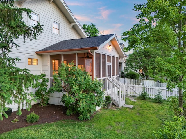 view of outbuilding featuring a sunroom