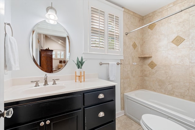 bathroom with tile patterned flooring, vanity, bathtub / shower combination, and toilet