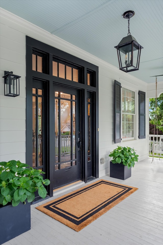 property entrance featuring covered porch
