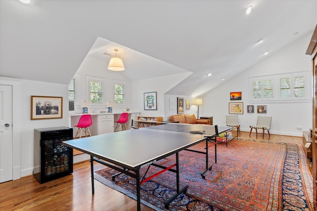 playroom featuring lofted ceiling, light wood-style floors, recessed lighting, and baseboards