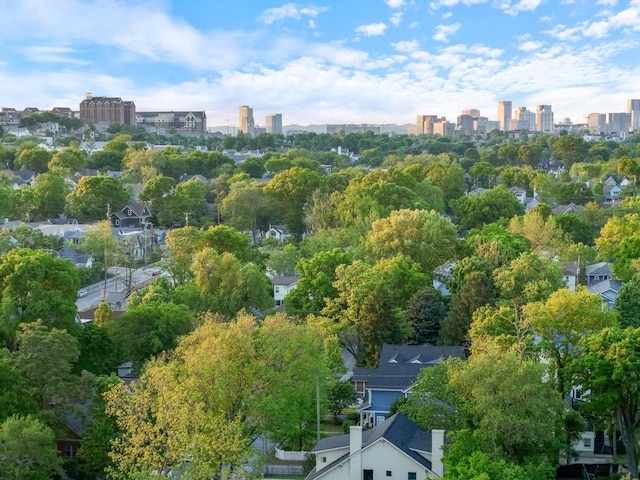 aerial view of property's location featuring nearby urban area