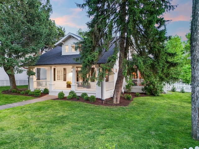 view of front of property with a porch and a shingled roof