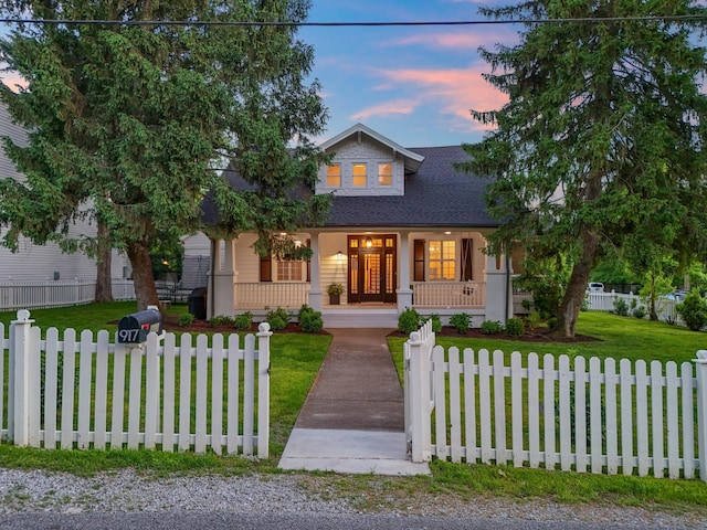 view of front of home featuring a porch and roof with shingles