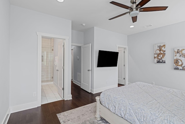 bedroom featuring wood finished floors, recessed lighting, baseboards, a ceiling fan, and ensuite bath