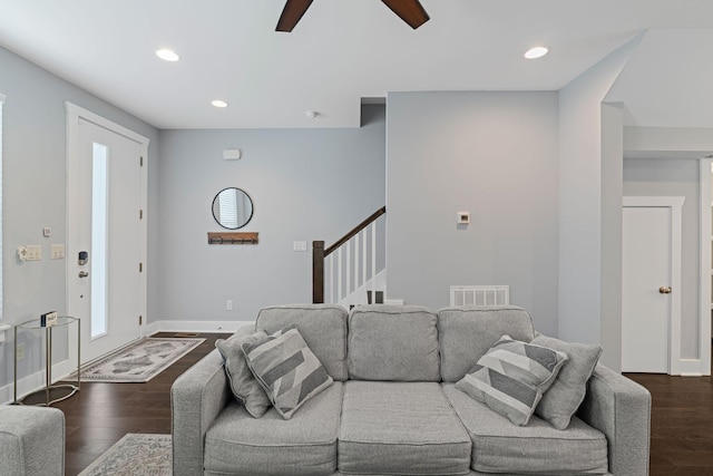 living room with dark wood finished floors, ceiling fan, recessed lighting, stairway, and baseboards