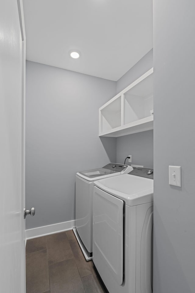 laundry room with separate washer and dryer, baseboards, and recessed lighting