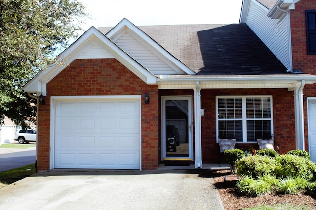 3718 Red Willow Ct, Murfreesboro, TN 37128 - view of front of home with concrete driveway, brick siding, covered porch, an attached garage, and roof with shingles
