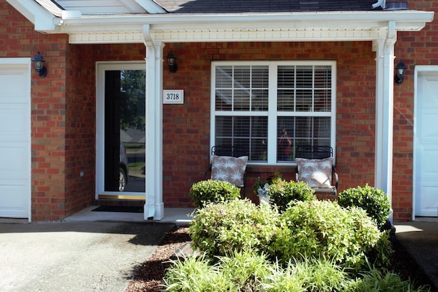 3718 Red Willow Ct, Murfreesboro, TN 37128 - property entrance featuring a shingled roof, brick siding, and covered porch