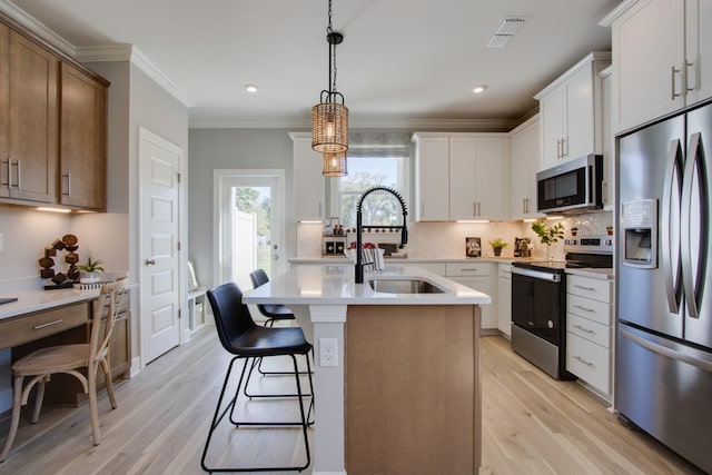 5211 Gladecress Ln, Hermitage, TN 37076 - kitchen with appliances with stainless steel finishes, a sink, light countertops, decorative backsplash, and light wood-type flooring