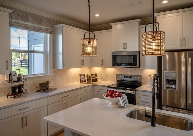 5211 Gladecress Ln, Hermitage, TN 37076 - kitchen featuring stainless steel appliances, a sink, white cabinetry, light countertops, and ornamental molding