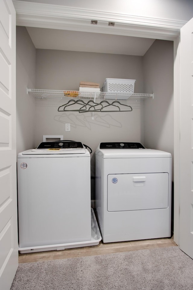 5211 Gladecress Ln, Hermitage, TN 37076 - laundry room with washing machine and clothes dryer and light wood-style flooring