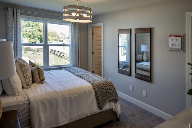 5211 Gladecress Ln, Hermitage, TN 37076 - bedroom with carpet, a chandelier, and baseboards
