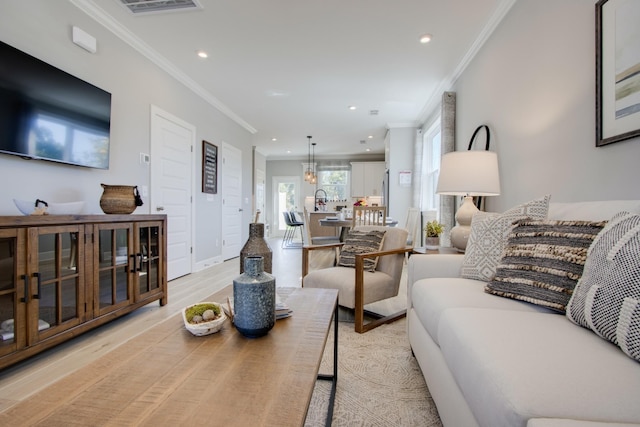 5211 Gladecress Ln, Hermitage, TN 37076 - living room with ornamental molding, recessed lighting, and light wood-style floors