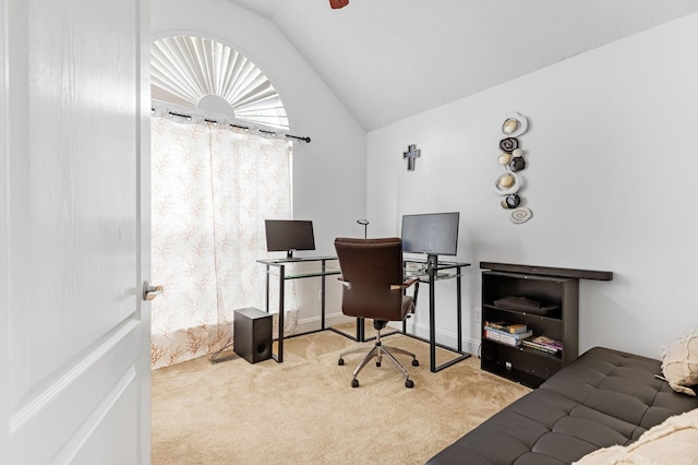 carpeted office space with vaulted ceiling