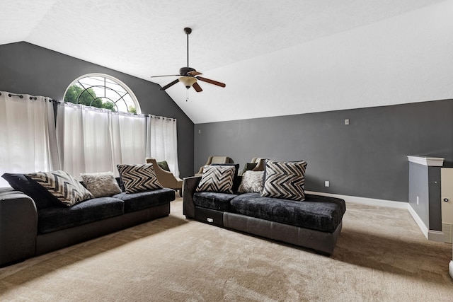 living area featuring lofted ceiling, carpet flooring, a ceiling fan, and baseboards