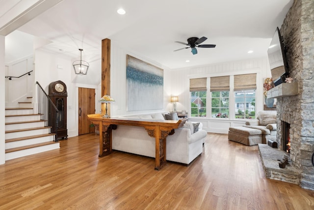1224 Adams St, Franklin, TN 37064 - living room featuring wood finished floors, a ceiling fan, stairway, a fireplace, and recessed lighting