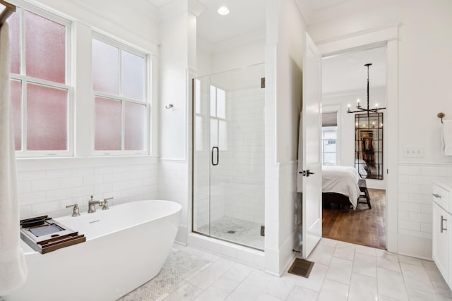 1224 Adams St, Franklin, TN 37064 - bathroom with tile walls, a stall shower, healthy amount of natural light, a soaking tub, and a wainscoted wall